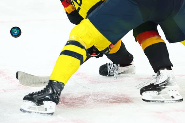 February 5, 2026, Milan, Lombardy, Italy: Official puck of the game as seen during a face-off in the Women s Preliminary Round Group B game between Team Sweden and Team Germany at the Milano Cortina 2026 Winter Olympic Games, Olympische Spiele, Olympia, OS Milan Italy - ZUMAc179 20260205_oly_c179_028 Copyright: xMickaelxChavetx