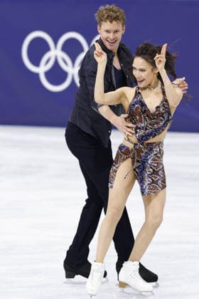 Milan Cortina Olympics: Figure skating, Eiskunstlauf American ice dancers Madison Chock (R) and Evan Bates perform their rhythm dance during the figure skating team event at the Milan Cortina Olympics at Milano Ice Skating Arena in Milan on Feb. 6, 2026.  A14AA0005248917P