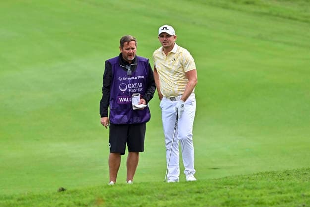 QATAR MASTERS 2026- SECOND ROUND Matt Wallace of England speaks with his caddy on the 15th green during second round of the Qatar Masters 2026 golf tournament at the Doha Golf Club on February 06, 2026. DOHA Qatar Copyright: xNOUSHADx