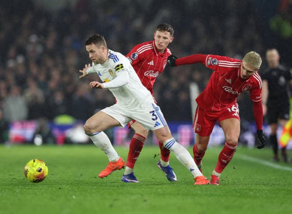 Leeds, England, 6th February 2026. Elliot Anderson and Nicolas Dominguez of Nottingham Forest fail to tackle Gabriel Gudmundsson of Leeds United during the Leeds United vs Nottingham Forest Premier League match at Elland Road, Leeds. Picture credit should read: Nigel Roddis Sportimage EDITORIAL USE ONLY. No use with unauthorised audio, video, data, fixture lists, club league logos or live services. Online in-match use limited to 120 images, no video emulation. No use in betting, games or single club league player publications. SPI_018_NR_LEED_NOTT SPI-4510-0018