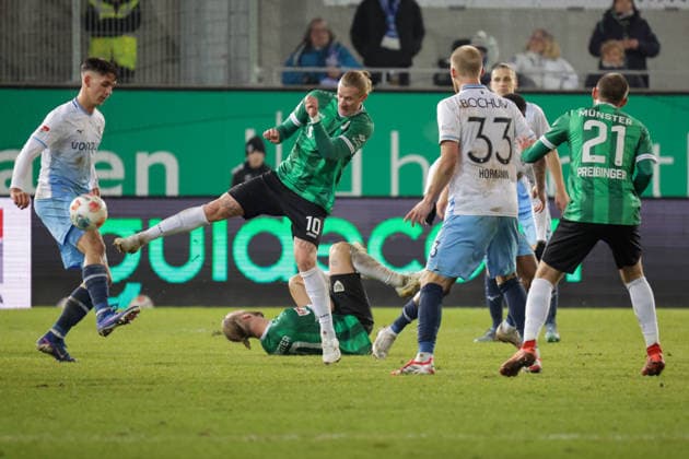 06.02.2026, xgrfx, Fussball 2.Bundesliga, Preußen Münster - VfL Bochum v.l. Cajetan Lenz (VfL Bochum), Marvin Schulz (Preußen Münster) (DFL DFB REGULATIONS PROHIBIT ANY USE OF PHOTOGRAPHS as IMAGE SEQUENCES and or QUASI-VIDEO) Münster