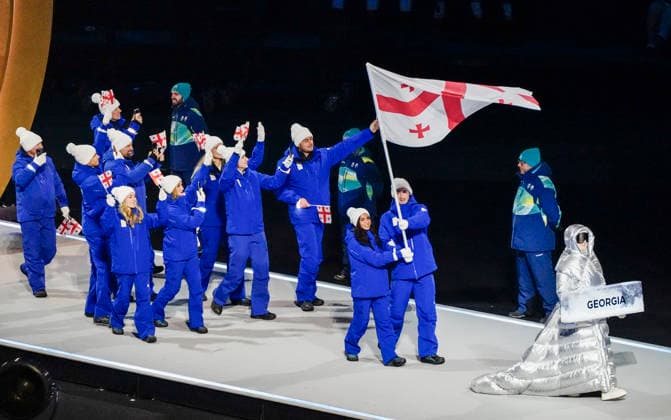 Athletes from Georgia walk in the parade of athletes during the Opening Ceremony of the Milano Cortina 2026 Olympic Games, Olympische Spiele, Olympia, OS at San Siro Stadium in Milan, Italy, on Friday, February 6, 2026. More than 2,900 athletes from 92 national Olympic committees will compete, with the United States having the largest presence with more than 230 athletes.  OLY20260206136 RICHARDxELLIS