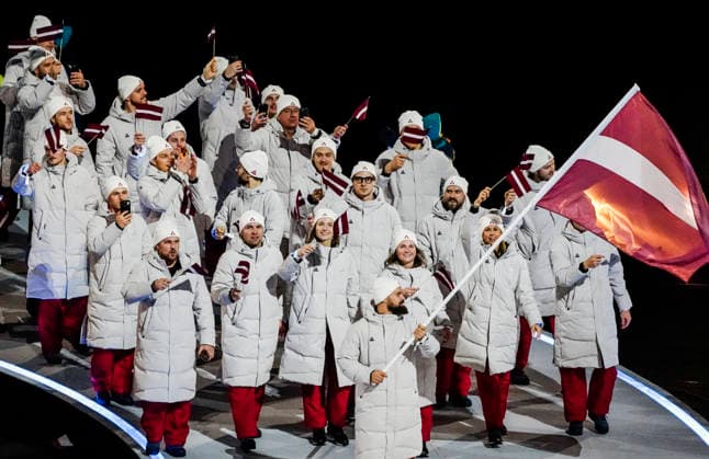 Athletes from Latvia walk in the parade of athletes during the Opening Ceremony of the Milano Cortina 2026 Olympic Games, Olympische Spiele, Olympia, OS at San Siro Stadium in Milan, Italy, on Friday, February 6, 2026. More than 2,900 athletes from 92 national Olympic committees will compete, with the United States having the largest presence with more than 230 athletes.  OLY20260206143 RICHARDxELLIS
