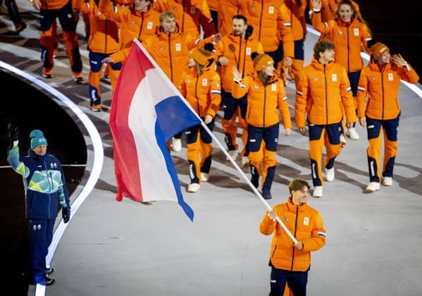 MILAN - Jens van t Wout carries the Dutch flag during the opening ceremony of the Winter Olympics in the San Siro Stadium. ROBIN VAN LONKHUIJSEN ANP xVIxANPxSportx xxANPxIVx 549848393 originalFilename: 549848393.jpg