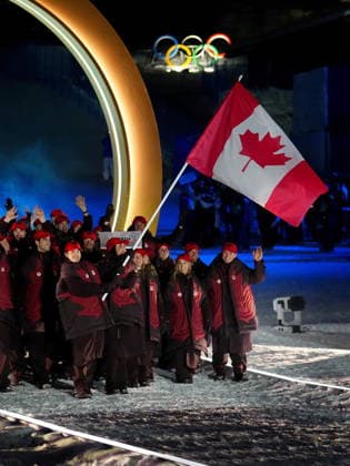 February 6, 2026, Livigno, So, Italy: Freestyle skiers Mikael Kingsbury and Marielle Thompson carry the Canada flag for Team Canada during the Milano Cortina 2026 Winter Olympic Games, Olympische Spiele, Olympia, OS opening ceremony in Livigno, Italy, Friday, Feb. 6, 2026. Canada News - February 6, 2026  - ZUMAc35_ 20260206_zaf_c35_120 Copyright: xSeanxKilpatrickx