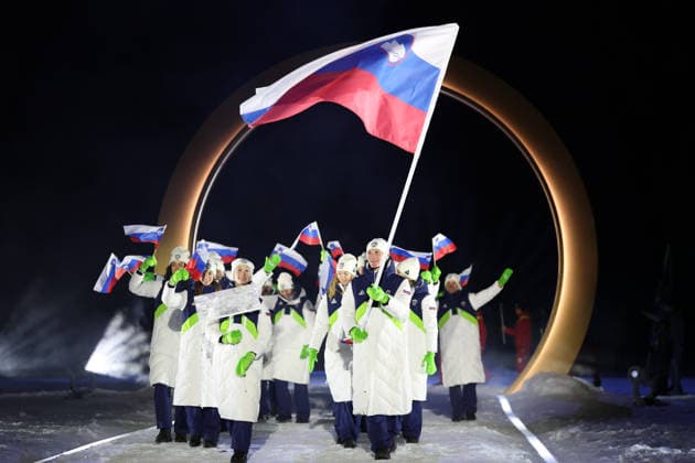 (260207) -- PREDAZZO, Feb. 7, 2026 -- The delegation of Slovenia parades into the Predazzo Ski jumping, Skispringen, Ski, nordisch Stadium during the opening ceremony of the Milan-Cortina 2026 Olympic Winter games, Winterspiele,Spiele, Summer games in Predazzo, Italy, Feb. 6, 2026. ) (MICO2026)ITALY-MILAN-CORTINA 2026-OLYMPIC WINTER GAMES-OPENING CEREMONY HuangxWei 
