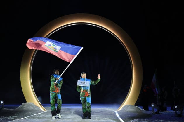(260207) -- PREDAZZO, Feb. 7, 2026 -- The delegation of Haiti parades into the Predazzo Ski jumping, Skispringen, Ski, nordisch Stadium during the opening ceremony of the Milan-Cortina 2026 Olympic Winter games, Winterspiele,Spiele, Summer games in Predazzo, Italy, Feb. 6, 2026. ) (MICO2026)ITALY-MILAN-CORTINA 2026-OLYMPIC WINTER GAMES-OPENING CEREMONY HuangxWei 