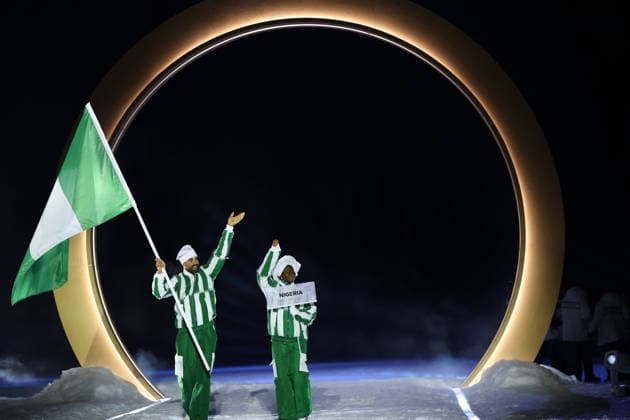 (260207) -- PREDAZZO, Feb. 7, 2026 -- The delegation of Nigeria parades into the Predazzo Ski jumping, Skispringen, Ski, nordisch Stadium during the opening ceremony of the Milan-Cortina 2026 Olympic Winter games, Winterspiele,Spiele, Summer games in Predazzo, Italy, Feb. 6, 2026. ) (MICO2026)ITALY-MILAN-CORTINA 2026-OLYMPIC WINTER GAMES-OPENING CEREMONY HuangxWei 