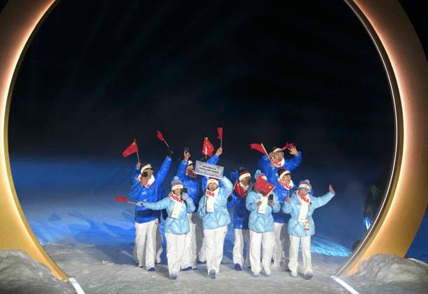 (260207) -- PREDAZZO, Feb. 7, 2026 -- The delegation of the People s Republic of China parades into the Predazzo Ski jumping, Skispringen, Ski, nordisch Stadium during the opening ceremony of the Milan-Cortina 2026 Olympic Winter games, Winterspiele,Spiele, Summer games in Predazzo, Italy, Feb. 6, 2026. ) (MICO2026)ITALY-MILAN-CORTINA 2026-OLYMPIC WINTER GAMES-OPENING CEREMONY MengxYongmin 