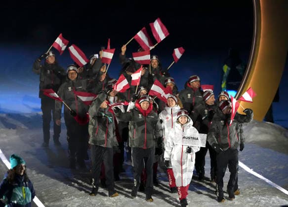 (260207) -- PREDAZZO, Feb. 7, 2026 -- The delegation of Austria parades into the Predazzo Ski jumping, Skispringen, Ski, nordisch Stadium during the opening ceremony of the Milan-Cortina 2026 Olympic Winter games, Winterspiele,Spiele, Summer games in Predazzo, Italy, Feb. 6, 2026. ) (MICO2026)ITALY-MILAN-CORTINA 2026-OLYMPIC WINTER GAMES-OPENING CEREMONY MengxYongmin 