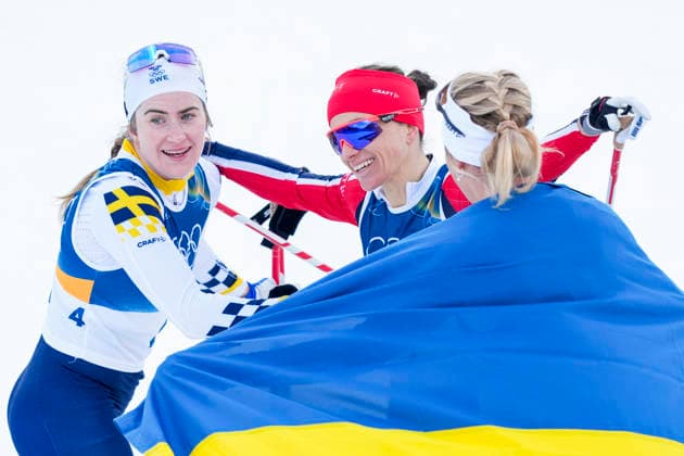 Winter Olympics in Milan Cortina 2026 Val di Fiemme, Italy 20260207. Frida Karlsson from Sweden, Ebba Andersson from Sweden and Heidi Weng from Norway cheer during the women s cross-country 20 km Skiathlon at Lago di Tesero during the Milan Cortina 2026 Winter Olympics. Photo: Lise Aserud NTB Val di Fiemme Italy EDITORIAL USE ONLY. RESTRICTED USE FOR BETTING COMPANIES Ref:_SPOwieq_hJX54Y.jpg *** Winter Olympics in Milan Cortina 2026 Val di Fiemme, Italy 20260207 Frida Karlsson from Sweden, Ebba Andersson from Sweden and Heidi Weng from Norway cheer during the women s cross country 20 km Skiathlon at Lago di Tesero during the Milan Cortina 2026 Winter Olympics Photo Lise Aserud NTB Val di Fiemme Italy EDITORIAL USE ONLY RESTRICTED USE FOR BETTING COMPANIES  Copyright: xLisexAserudx xNTBx