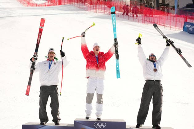 (260207) -- BORMIO, Feb. 7, 2026 -- Gold medalist Franjo von Allmen (C) of Switzerland, silver medalist Giovanni Franzoni (L) of Italy and bronze medalist Dominik Paris of Italy celebrate during the awarding ceremony for the alpine skiing men s downhill of the Milan-Cortina 2026 Olympic Winter games, Winterspiele,Spiele, Summer games in Bormio, Italy, Feb. 7, 2026. ) (MICO2026)ITALY-BORMIO-OLYMPIC WINTER GAMES-ALPINE SKIING-MEN S DOWNHILL YanxLinyun 