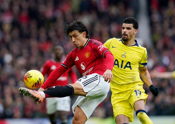 Manchester, England, 7th February 2026. Dominic Solanke of Tottenham (r) pressures Lisandro Martinez of Manchester United, ManU (l) during the Manchester United vs Tottenham Hotspur Premier League match at Old Trafford, Manchester. Picture credit should read: Andrew Yates Sportimage EDITORIAL USE ONLY. No use with unauthorised audio, video, data, fixture lists, club league logos or live services. Online in-match use limited to 120 images, no video emulation. No use in betting, games or single club league player publications. SPI_073_AY_Man_Utd_Spurs SPI-4511-0073