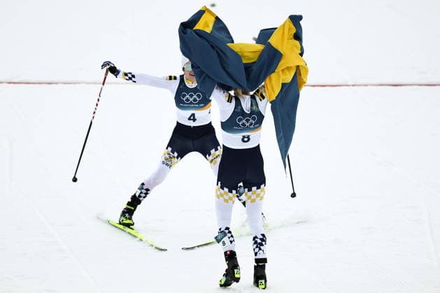 ITALY, TRENTINO-SOUTH TYROL - FEBRUARY 7, 2026: Ebba Andersson (L) and Frida Karlsson of Sweden celebrate coming second and first respectively in a women s 10km + 10km skiathlon race during the 2026 Winter Olympic Games, Olympische Spiele, Olympia, OS at the Tesero Cross-Country Skiing Stadium 2026 Winter Olympics: Cross-Country Skiing  - ZUMAt113 20260207_zaa_t113_210 Copyright: xMikhailxTereshchenkox