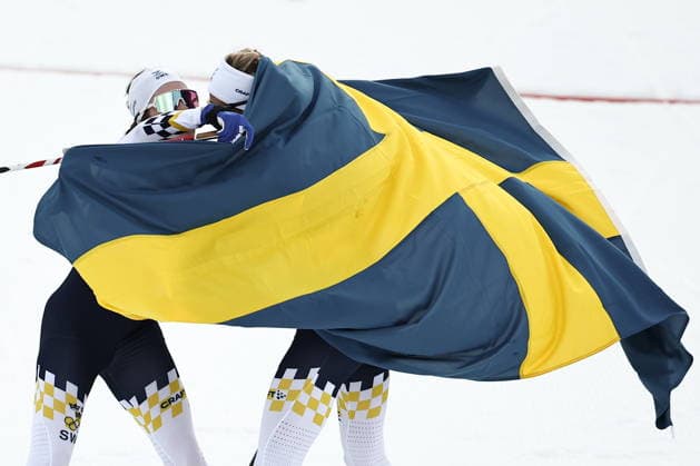 ITALY, TRENTINO-SOUTH TYROL - FEBRUARY 7, 2026: Ebba Andersson (L) and Frida Karlsson of Sweden celebrate coming second and first respectively in a women s 10km + 10km skiathlon race during the 2026 Winter Olympic Games, Olympische Spiele, Olympia, OS at the Tesero Cross-Country Skiing Stadium 2026 Winter Olympics: Cross-Country Skiing  - ZUMAt113 20260207_zaa_t113_211 Copyright: xMikhailxTereshchenkox