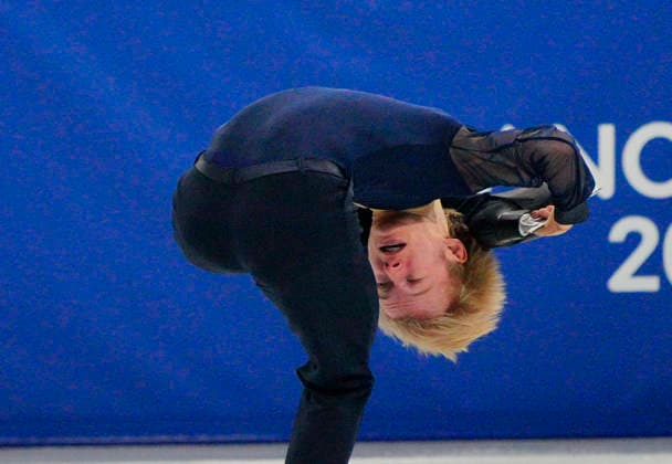 Daniel Grassl of Italy performs his routine during the Men s Singles Figure skating, Eiskunstlauf Team Event at the Milano Figure Skating Arena in Milan, Italy on Saturday, February 7, 2026.  OLY20260230118 RichardxEllis
