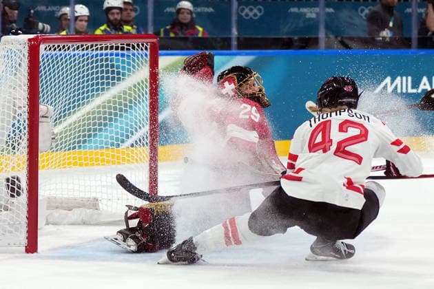 February 7, 2026, Milan, ITALY: Switzerland goalie Saskia Maurer (29) makes the save on CanadaöÄÃ s Claire Thompson (42) during the first period of a preliminary round women s hockey game at the Milan Cortina Winter Olympics, in Milan, on Saturday, Feb. 7, 2026. Canada News - February 7, 2026  - ZUMAc35_ 20260207_zaf_c35_089 Copyright: xDarrylxDyckx