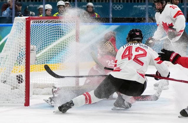 February 7, 2026, Milan, ITALY: Switzerland goalie Saskia Maurer (29) makes the save on CanadaöÄÃ s Claire Thompson (42) during the first period of a preliminary round women s hockey game at the Milan Cortina Winter Olympics, in Milan, on Saturday, Feb. 7, 2026. Canada News - February 7, 2026  - ZUMAc35_ 20260207_zaf_c35_093 Copyright: xDarrylxDyckx