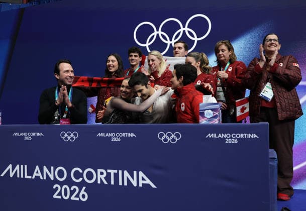 (260208) -- MILAN, Feb. 8, 2026 -- Marjorie Lajoie (front 2nd L) Zachary Lagha (front 2nd R) of Canada react to their scores after performing during the free dance of ice dance skating for Figure skating, Eiskunstlauf team event at the Milan-Cortina 2026 Olympic Winter games, Winterspiele,Spiele, Summer games in Milan, Italy, Feb. 7, 2026. ) (MICO2026)ITALY-MILAN-OLYMPIC WINTER GAMES-FIGURE SKATING TEAM EVENT-ICE DANCE-FREE DANCE ChenxYichen 