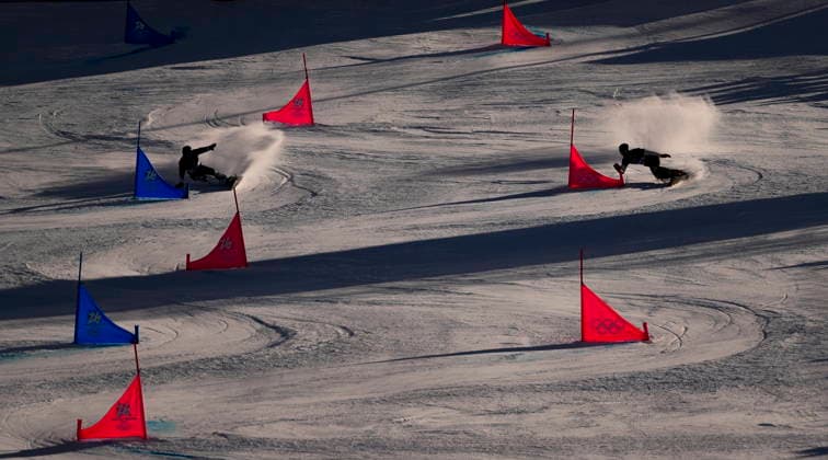 February 8, 2026, Livigno, Italy: Arnaud Gaudet, from Montcalm, Que., left, races against Fabian Obmann of Austria in the men s parallel giant slalom qualification at the Milano Cortina 2026 Winter Olympic Games, Olympische Spiele, Olympia, OS in Livigno, Italy on Sunday, Feb. 8, 2026. Canada News - February 8, 2026  - ZUMAc35_ 20260208_zaf_c35_002 Copyright: xSeanxKilpatrickx