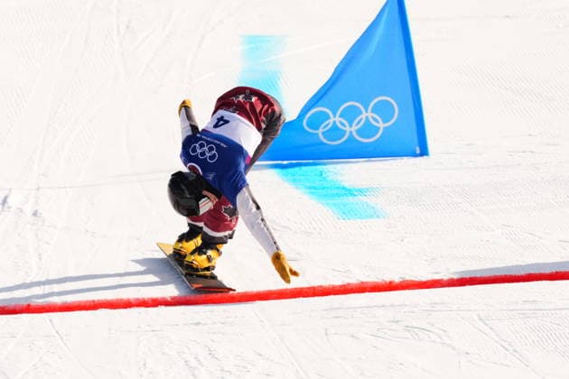 February 8, 2026, Livigno, Italy: Arnaud Gaudet, from Montcalm, Que., crosses the finish line in the men s snowboarding parallel giant slalom 1 8 finals at the 2026 Winter Olympics, in Livigno, Italy, Sunday, Feb. 8, 2026. Canada News - February 8, 2026  - ZUMAc35_ 20260208_zaf_c35_030 Copyright: xSeanxKilpatrickx