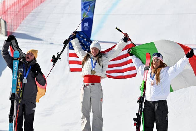 Cortina d Ampezzo, Italy, February 08th 2026. First place Breezy Johnson of United States of America (C), Second place Emma Aicher of Germany (L) and Third place Sofia Goggia of Italy (R) celebrate in podium after the Alpine Skiing Womens Downhill race of the Olympic Winter games, Winterspiele,Spiele, Summer games 2026 in Cortina d Ampezzo, Italy. (Photo by Igor Kupljenik Sports Press Photo)  Copyright: xIgorxKupljenikx xSPPx Sportspressphoto_SPR90081