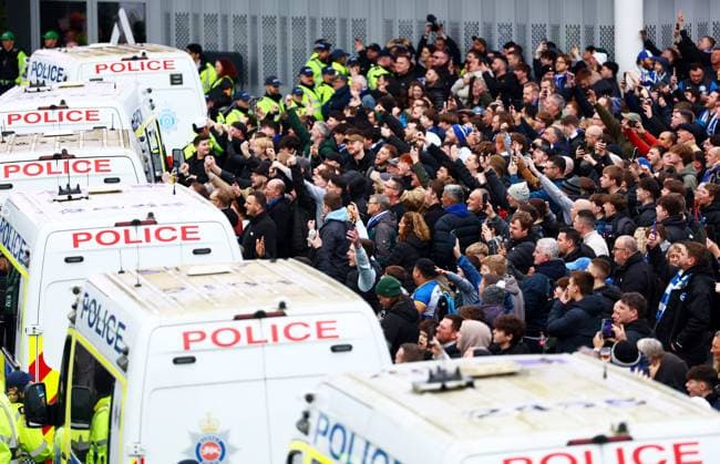 Brighton fans are seperated by Police. Brighton and Hove Albion v Crystal Palace, Premier League, Football, American Express Community Stadium, Brighton, UK - 08 Feb 2026Brighton American Express Community Stadi United Kingdom EDITORIAL USE ONLY No use with unauthorised audio, video, data, fixture lists, club league logos or live services. Online in-match use limited to 120 images, no video emulation. No use in betting, games or single club league player publications. Copyright: xJamesxMarsh Shutterstockx 16524415k