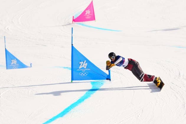 February 8, 2026, Livigno, Italy: Arnaud Gaudet, from Montcalm, Que., competes in the men s snowboarding parallel giant slalom quarterfinals against Bulgaria s Tervel Zamfirov, not shown, at the 2026 Winter Olympics, in Livigno, Italy, Sunday, Feb. 8, 2026. Canada News - February 8, 2026  - ZUMAc35_ 20260208_zaf_c35_035 Copyright: xSeanxKilpatrickx