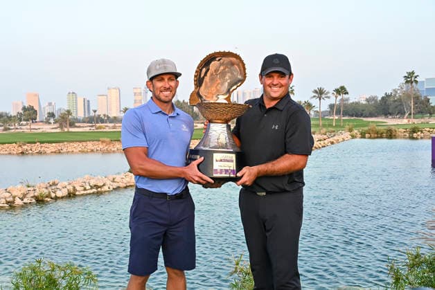 Qatar Masters 2026 - Day Four Patrick Reed of the United States and his caddie, Kessler Karain pose with the trophy following victory on day four of the Qatar Masters 2026 golf tournament at the Doha Golf Club in Doha, Qatar, on February 8, 2026. Doha Qatar Copyright: xNOUSHADx 776441069