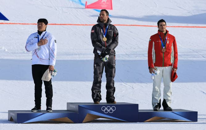 OLYMPICS - Winter Olympic Games, Olympische Spiele, Olympia, OS Milano Cortina 2026 LIVIGNO,ITALY,08.FEB.26 - OLYMPICS, SNOWBOARD - Winter Olympic Games Milano Cortina 2026, Parallel Giant Slalom, final, women, men. Image shows Sangkyum Kim (KOR), Benjamin Karl (AUT) and Tervel Zamfirov (BUL). Keywords: medal.  GEPAxpictures xWolfgangxGrebien