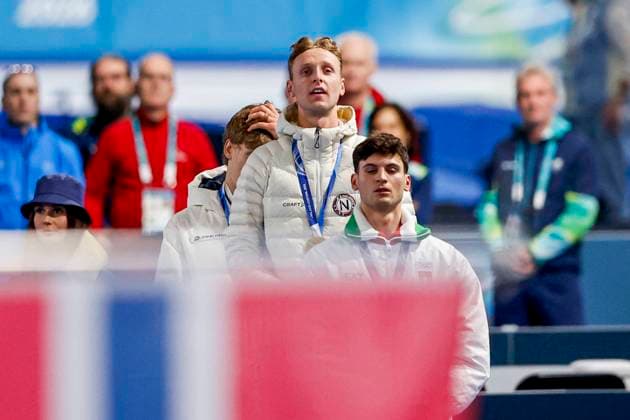 second Metodej Jilek of Czechia and winner Sander Eitrem of Norway and third Riccardo Lorello of Italy looks on during the medal ceremony after Men 5000m, Milano Cortina 2026 Winter Olympics: Day 2, Speed skating, Eisschnelllauf - Milano Cortina 2026 Winter Olympics: Day 2, Milano Speed Skating Stadium, February 8, 2026, Milan, Italy.