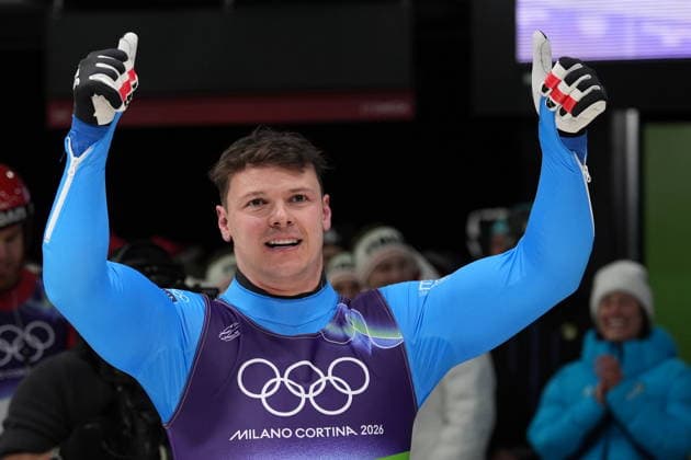 Italy s Dominik Fischnaller celebrates winning the bronze medal as he arrives at the finish during a men s single luge run at the 2026 Winter Olympics, in Cortina d Ampezzo, Italy, Sunday, Feb. 8, 2026 (Spada LaPresse)  Copyright: xSpada LaPressex