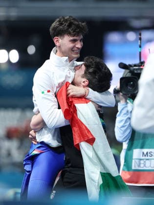 (260208) -- MILAN, Feb. 8, 2026 -- Riccardo Lorello (L) of Italy celebrates after the Speed skating, Eisschnelllauf men s 5000m match at the Milan-Cortina 2026 Olympic Winter games, Winterspiele,Spiele, Summer games in Milan, Italy, Feb. 8, 2026. ) (MICO2026)ITALY-MILAN-OLYMPIC WINTER GAMES-SPEED SKATING-MEN S 5000M DuxXiaoyi 