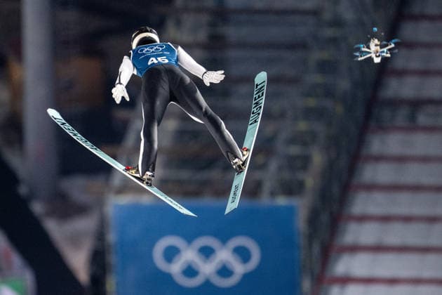 OLYMPICS - Winter Olympic Games, Olympische Spiele, Olympia, OS Milano Cortina 2026 VAL DI FIEMME,ITALY,08.FEB.26 - OLYMPICS, Ski jumping, Skispringen, Ski, nordisch - Winter Olympic Games Milano Cortina 2026, normal hill, men, training. Image shows Philipp Raimund (GER) and a drone.  GEPAxpictures xOliverxLerch