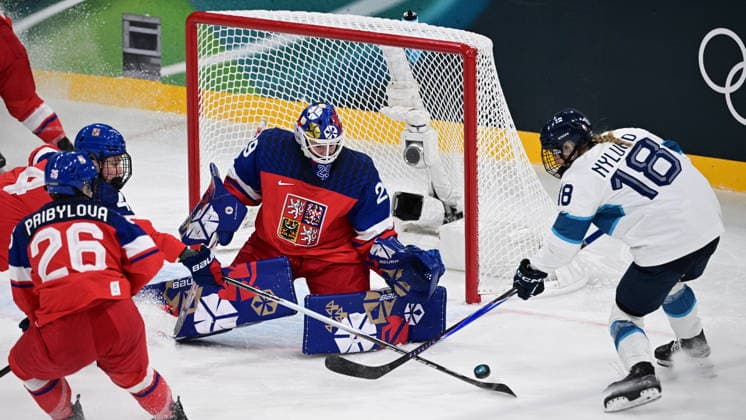 L-R Vendula Pribylova (CZE), goalkeeper Klara Peslarova (CZE) and Jenniina Nylund (FIN) in action during women s Ice hockey, Eishockey match of Group A: Czechia vs Finland, at the Milano Cortina 2026 Winter Olympic Games, Olympische Spiele, Olympia, OS in Milan, Italy, on February 8, 2026. (CTKxPhoto MichalxKamaryt) CTKPhotoP2026020807956  CTKPhotoP2026020807956