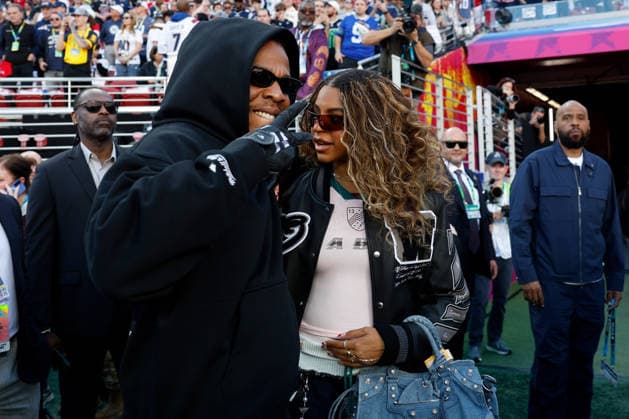 Singer-songwriter Beyonce, right, and Jay Z, left, walk on the field before the start of Super Bowl LX at at Levi s Stadium in Santa Clara, California on Sunday, February 8, 2026.  SBP20260208116 JOHNxANGELILLO