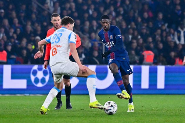 FOOTBALL : PSG vs Marseille - Ligue1 - 08 02 2026 Ousmane DEMBELE ( 10 - PSG ) and Benjamin Pavard ( 28 - Olympique Marseille ) during the Ligue 1 match between Paris Saint Germain and Olympique Marseille at Parc Des Princes on February 08 , 2026 in Paris, France. ( Photo by Federico Pestelini PsnewZ ) - ParisFrance  Copyright: xFedericoxPestelinix