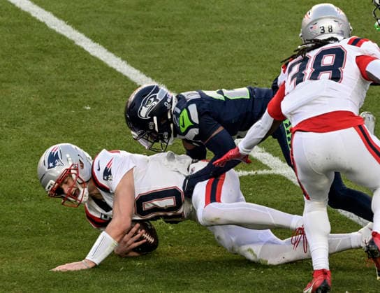 New England Patriots quarterback Drake Maye (10) is sacked by Seattle Seahawks cornerback Devon Witherspoon (21) in the first quarter of Super Bowl LX at at Levi s Stadium in Santa Clara, California on Sunday, February 8, 2026.  SBP20260208822 JONxSOOHOO
