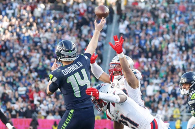 New England Patriots safety Jaylinn Hawkins center, and New England Patriots safety Jaylinn Hawkins right, rush Seattle Seahawks quarterback Sam Darnold during the first quarter of Super Bowl LX at at Levi s Stadium in Santa Clara, California on Sunday, February 8, 2026.  SBP20260208A89 JOHNxANGELILLO