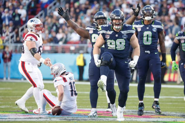 Seattle Seahawks defensive tackle Rylie Mills second from right, celebrate his sack of New England Patriots quarterback Drake Maye second from left, during the second quarter of Super Bowl LX at Levi s Stadium in Santa Clara, California on Sunday, February 8, 2026.  SBP20260208147 JOHNxANGELILLO