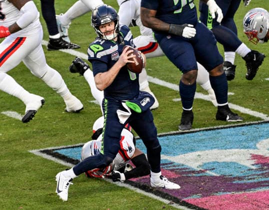 Seattle Seahawks quarterback Sam Darnold (14) scrambles against the New England Patriots in the second quarter of Super Bowl LX at at Levi s Stadium in Santa Clara, California on Sunday, February 8, 2026.  SBP20260208831 JONxSOOHOO