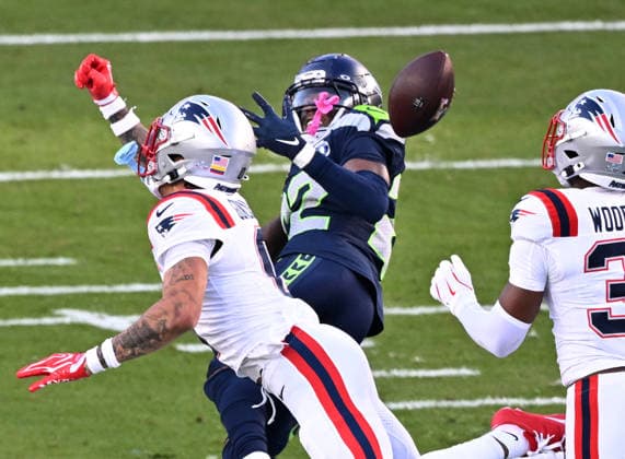 Seattle Seahawks wide receiver Rashid Shaheed (22) tries to make a catch while being defended by New England Patriots cornerback Christian Gonzalez (0) in the second quarter of Super Bowl LX at Levi s Stadium in Santa Clara, California on Sunday, February 8, 2026.  SBP20260208443c DAVIDxTULIS