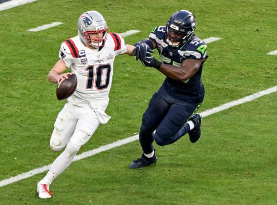 Seattle Seahawks linebacker Boye Mafe (53) chases down New England Patriots quarterback Drake Maye (10) in the second quarter of Super Bowl LX at at Levi s Stadium in Santa Clara, California on Sunday, February 8, 2026.  SBP20260208835 JONxSOOHOO