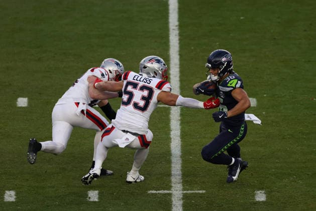 SANTA CLARA, CA - FEBRUARY 08: LB Christian Elliss (53) of the New England Patriots tries to tackle RB George Holani (36) of the Seattle Seahawks during the Seattle Seahawks versus the New England Patriots Super Bowl LX game on February 8, 2026, at Levi s Stadium in Santa Clara, CA. (Photo by Matthew Huang Icon Sportswire) NFL, American Football Herren, USA FEB 08 Super Bowl LX Seahawks vs Patriots EDITORIAL USE ONLY Icon26010112208
