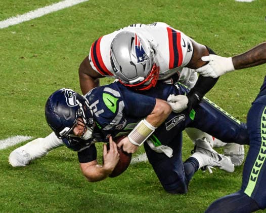 New England Patriots defensive end Milton Williams (97) sacks Seattle Seahawks quarterback Sam Darnold (14) for an eight yard loss in the third quarter of Super Bowl LX at at Levi s Stadium in Santa Clara, California on Sunday, February 8, 2026.  SBP20260208854 JONxSOOHOO