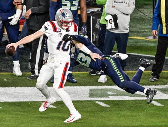 Seattle Seahawks linebacker Ernest Jones IV (13) tackles New England Patriots quarterback Drake Maye (10) in the third quarter of Super Bowl LX at at Levi s Stadium in Santa Clara, California on Sunday, February 8, 2026.  SBP20260208856 JONxSOOHOO