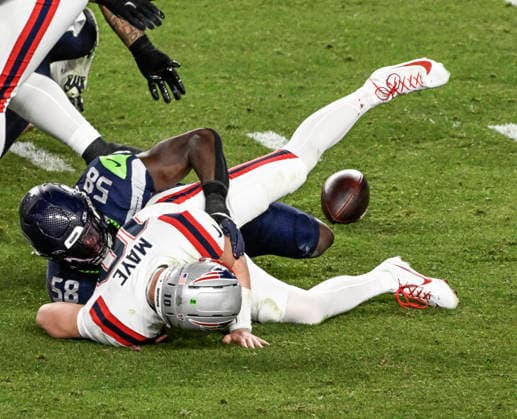 New England Patriots quarterback Drake Maye (10) fumbles the ball as he is tackled by Seattle Seahawks linebacker Derick Hall (58) in the third quarter of Super Bowl LX at at Levi s Stadium in Santa Clara, California on Sunday, February 8, 2026.  SBP20260208857 JONxSOOHOO