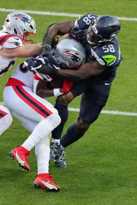 SANTA CLARA, CA - FEBRUARY 08: Seattle Seahawks linebacker Derick Hall (58) tackles New England Patriots running back Rhamondre Stevenson (38) during the Seattle Seahawks versus the New England Patriots Super Bowl LX game on February 8, 2026, at Levi s Stadium in Santa Clara, CA. (Photo by Jevone Moore Icon Sportswire) NFL, American Football Herren, USA FEB 08 Super Bowl LX Seahawks vs Patriots EDITORIAL USE ONLY Icon2602083147