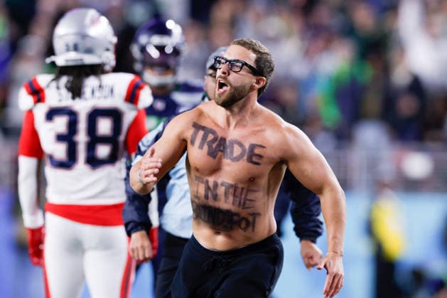 A shirtless fan runs on the field during the fourth quarter of Super Bowl LX between the New England Patriots and the Seattle Seahawks at Levi s Stadium in Santa Clara, California on Sunday, February 8, 2026.  SBP20260208191 JOHNxANGELILLO