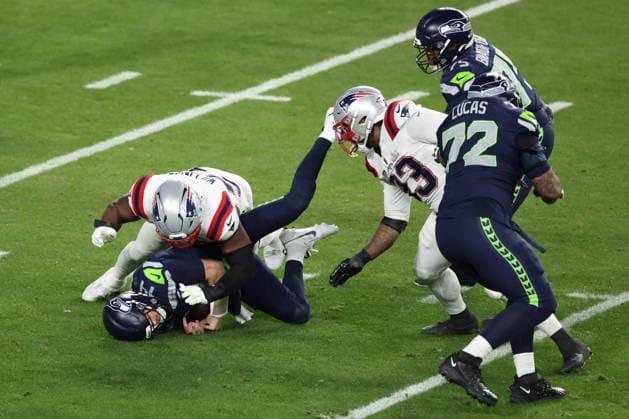 SANTA CLARA, CA - FEBRUARY 08: QB Sam Darnold (14) of the Seattle Seahawks is sacked by DT Milton Williams (97) of the New England Patriots during the Seattle Seahawks versus the New England Patriots Super Bowl LX game on February 8, 2026, at Levi s Stadium in Santa Clara, CA. (Photo by Matthew Huang Icon Sportswire) NFL, American Football Herren, USA FEB 08 Super Bowl LX Seahawks vs Patriots EDITORIAL USE ONLY Icon26010124309